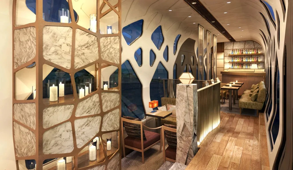 Lounge Komorebi du Train Suite Shiki-Shima &mdash; bar avec arbre dor&eacute; et structure organique blanche, photo r&eacute;elle du train de luxe JR East