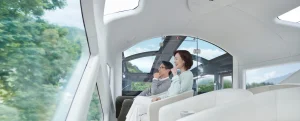 View Terrace du Train Suite Shiki-Shima &mdash; couple dans le salon dome panoramique avec toit vitr&eacute; face aux for&ecirc;ts japonaises